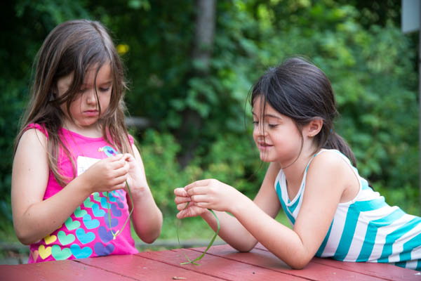 Campers connect with nature based crafts.